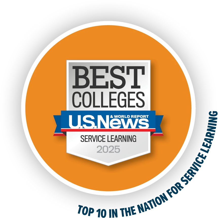 Circular badge featuring a silver and blue U.S. News & World Report emblem labeled “Best Colleges – Service Learning 2025,” with the surrounding orange ring reading “Top 10 in the Nation for Service Learning.”