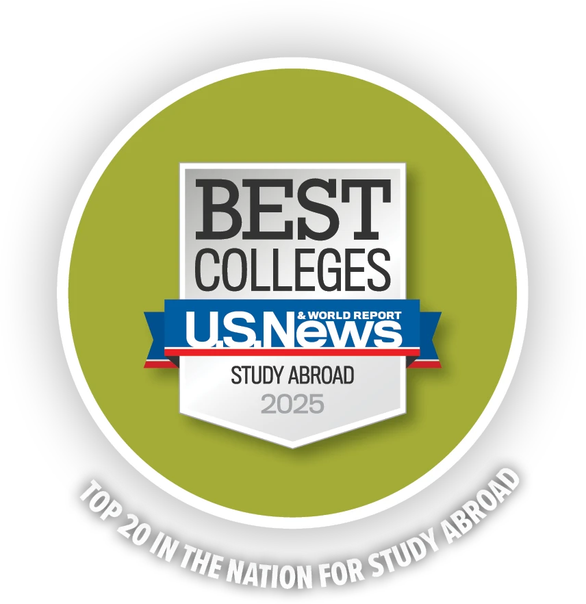 U.S. News & World Report badge on a green circle background labeled “Best Colleges – Study Abroad – 2025,” with the caption “Top 20 in the Nation for Study Abroad.”