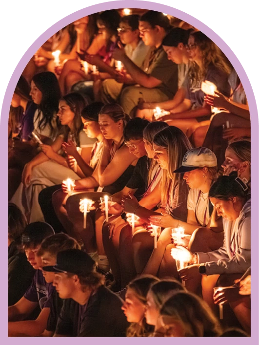 Students holding candles during ACU’s Candlelight Devo.